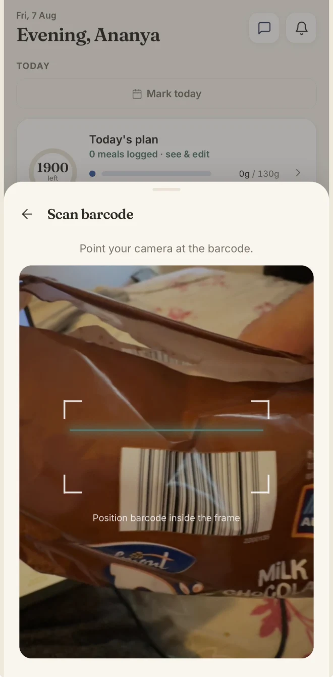 Scanning a packaged food in the Keenuva client app: the camera framing a barcode.